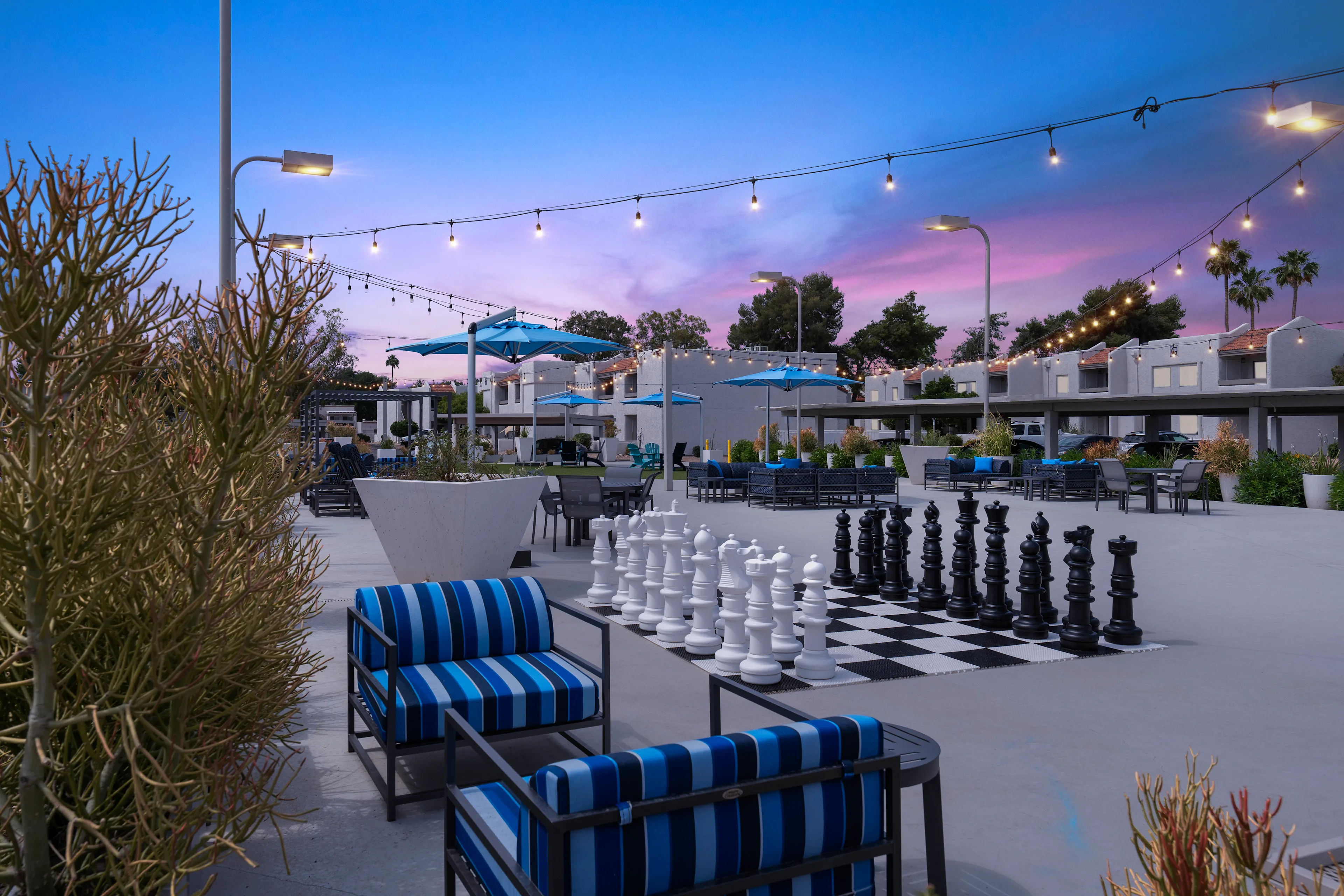 Arizona resort property lit at dusk with warm LED path and palm lighting